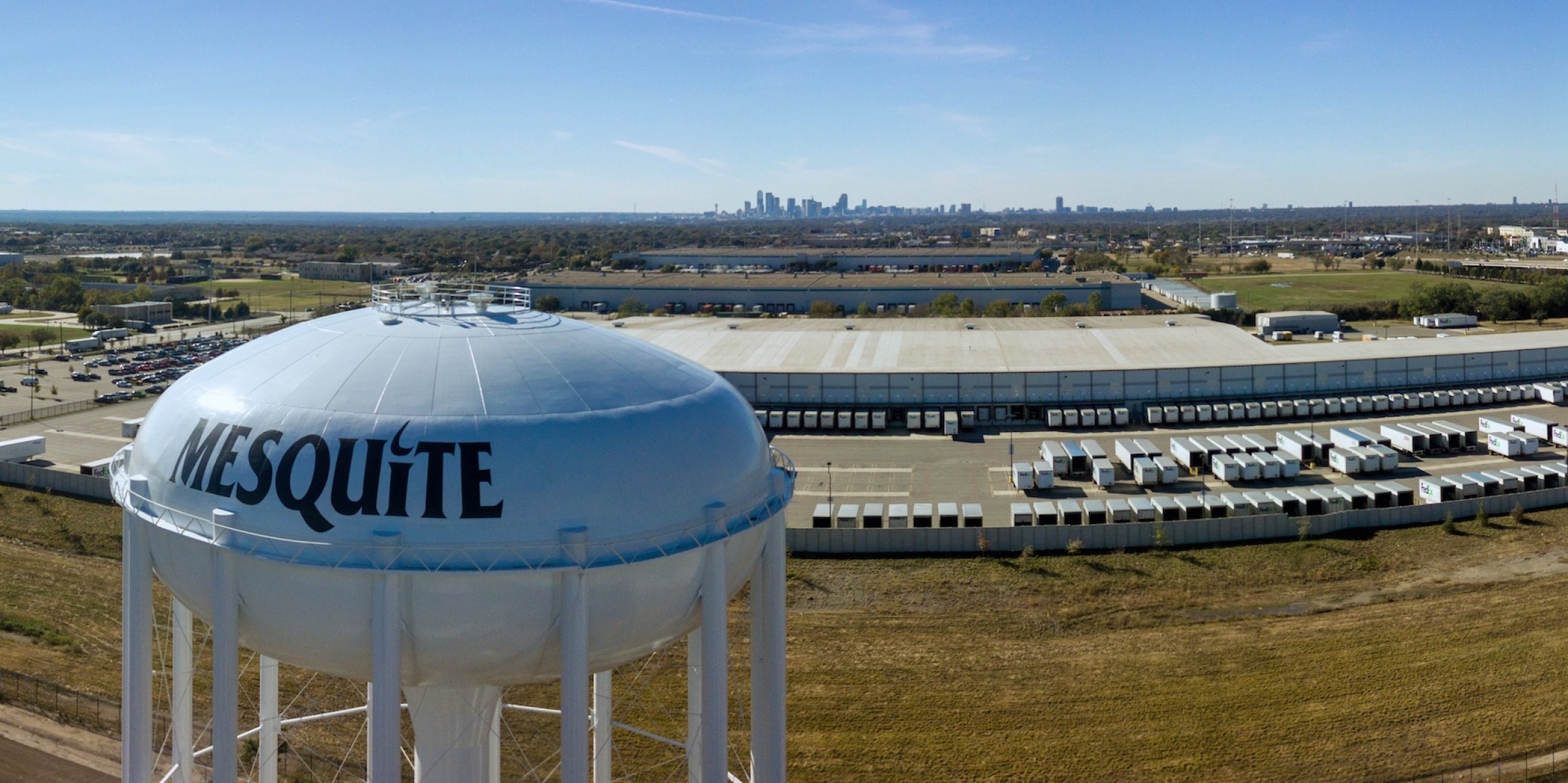 Aerial view of Mesquite's water tower with a warehoue in the background